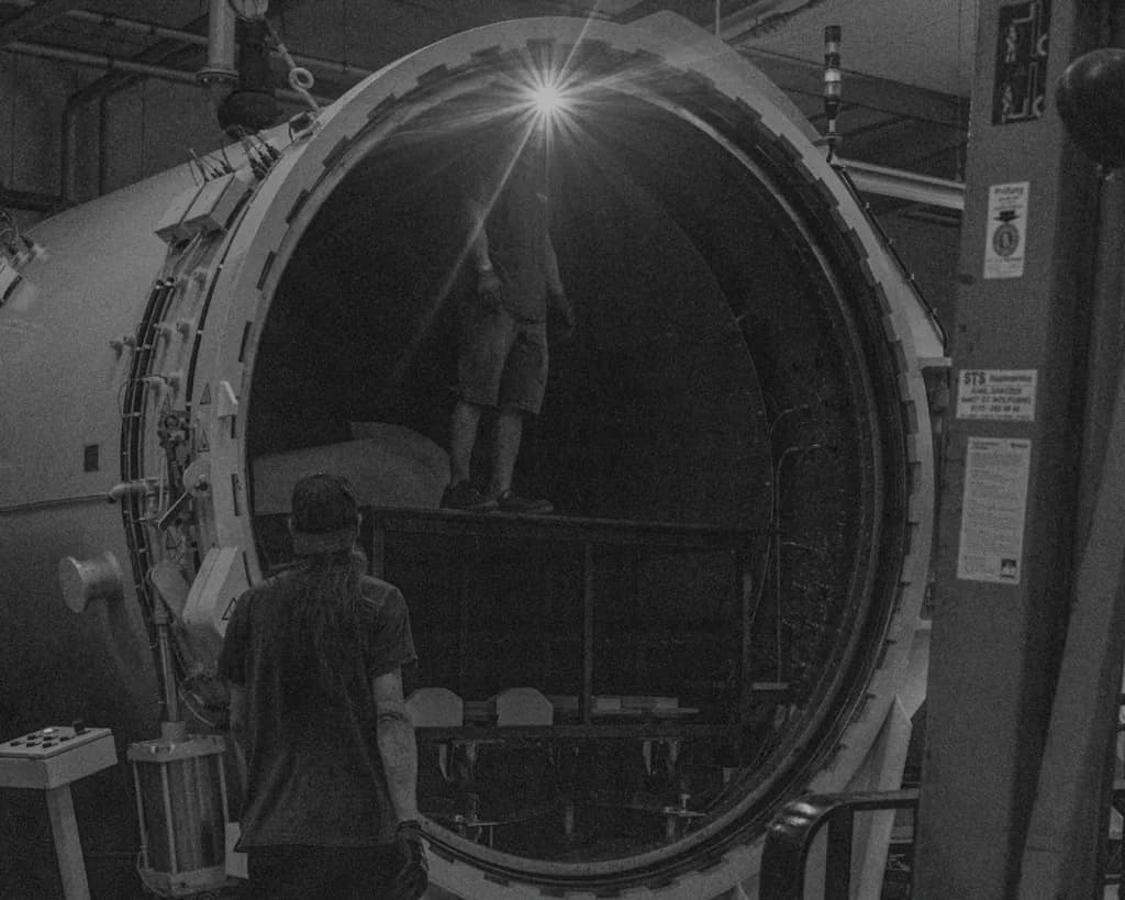 Open autoclave with technicians