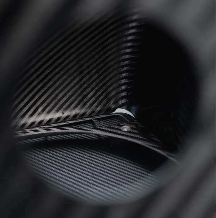 Carbon fiber weave through a circular aperture